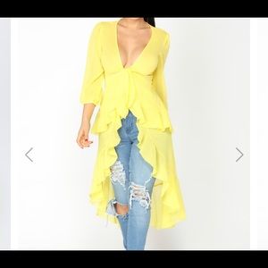A sheer yellow hi lo top